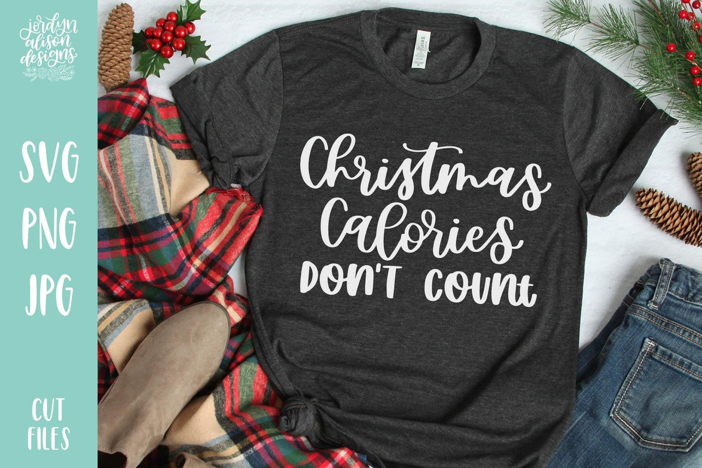 Grey T-Shirt with Handwritten text "Christmas Calories Don't Count" in white letters