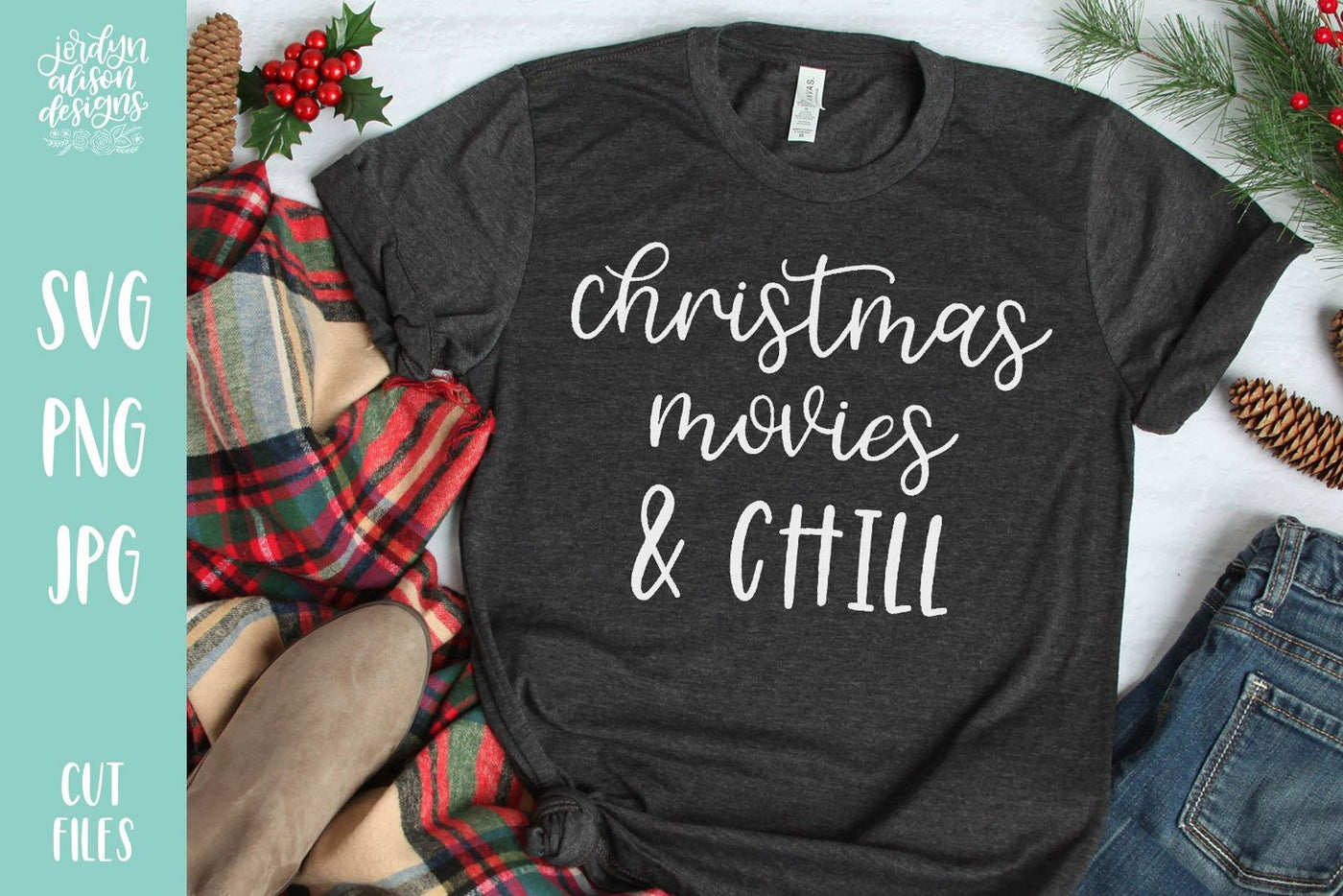 Grey T-Shirt with Handwritten text "Christmas Movies and Chill " in white letters