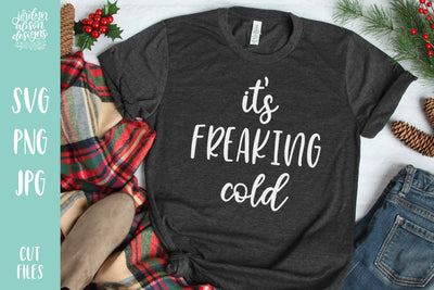 Grey T-Shirt with Handwritten text "Its' Freaking cold" in white letters