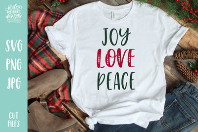 White T-shirt with handwritten text "Joy Love Peace"