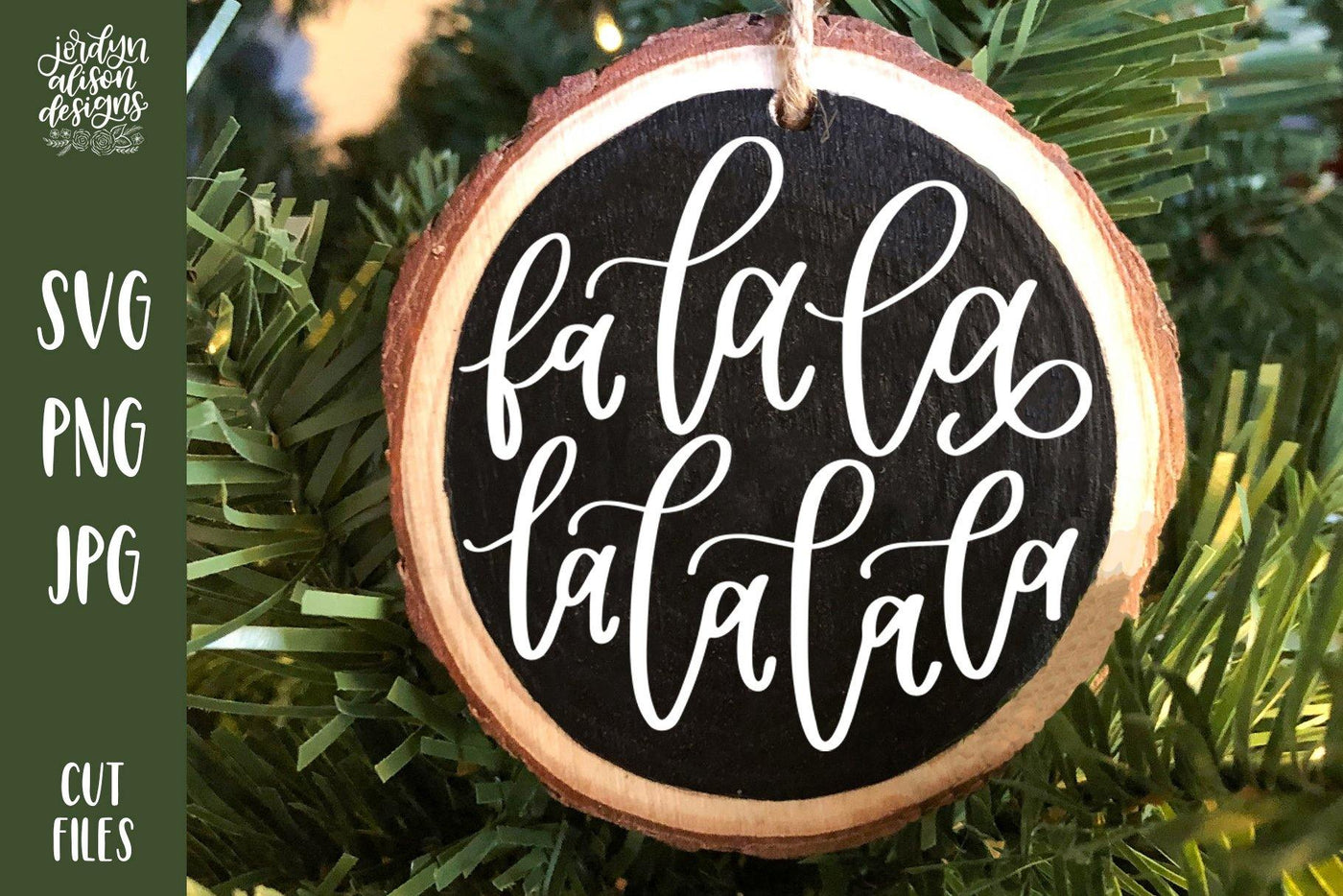 Handwritten text "Fa La La" on Round Christmas Ornament. 